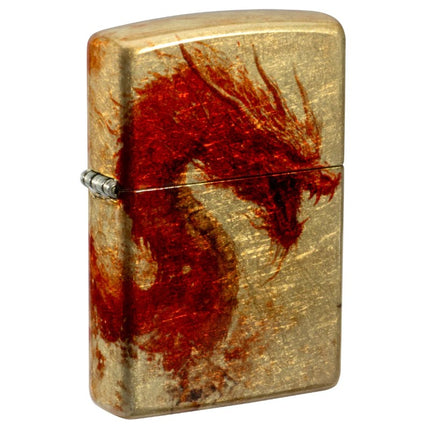 A close-up view of the front of a Zippo lighter with a Tumbled Brass finish. It features a vibrant, detailed wraparound design of a fiery red dragon with orange accents, covering the entire surface of the lighter body and lid.